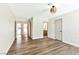 Spacious bedroom featuring wood-look flooring and ample natural light throughout the home at 1719 Rolling Hills Dr, Las Vegas, NV 89156