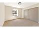 Cozy bedroom featuring soft carpet, neutral walls, and a sliding door closet at 1719 Rolling Hills Dr, Las Vegas, NV 89156
