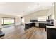 Bright open floor plan combines kitchen with bar seating, stainless appliances, and outdoor access at 1719 Rolling Hills Dr, Las Vegas, NV 89156