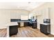 Modern kitchen features two-tone cabinetry, sleek countertops, stainless steel appliances, and stylish backsplash at 1719 Rolling Hills Dr, Las Vegas, NV 89156