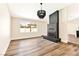 Cozy living room features a decorative fireplace, ample natural light from a large window, and neutral paint at 1719 Rolling Hills Dr, Las Vegas, NV 89156