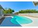Bright, newly surfaced pool with clean concrete surround and block wall for privacy at 1719 Rolling Hills Dr, Las Vegas, NV 89156