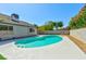 Inviting backyard with a beautiful blue pool, patio, and well-maintained landscaping at 1719 Rolling Hills Dr, Las Vegas, NV 89156