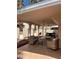 Covered back patio with seating, ceiling fans, and tiled flooring at 1853 Citroen St, Las Vegas, NV 89142