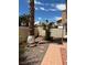 Backyard landscaping featuring a stone walkway and mature plantings at 1853 Citroen St, Las Vegas, NV 89142