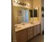 Bathroom featuring double sinks, white countertops, and neutral-colored cabinetry at 1853 Citroen St, Las Vegas, NV 89142