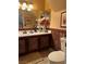 Bathroom featuring a vanity with a single sink, wood cabinets, and a standard toilet at 1853 Citroen St, Las Vegas, NV 89142