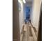 Hallway with hardwood flooring and white painted walls with light fixture on the ceiling at 1853 Citroen St, Las Vegas, NV 89142