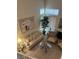 Bright living room with high ceilings, neutral decor, fireplace, and comfortable seating area at 1853 Citroen St, Las Vegas, NV 89142