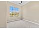 Neutral bedroom with carpet, and a bright window with an view of the neighborhood at 20 Via Visione # 105, Henderson, NV 89011