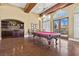 Game room features a pool table, custom lighting, and a wet bar with a sink at 20 Via Visione # 105, Henderson, NV 89011
