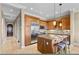 Well-equipped kitchen with stainless steel appliances, granite countertops, a kitchen island and barstool seating at 20 Via Visione # 105, Henderson, NV 89011