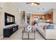 Cozy living room flowing into the kitchen, showcasing modern decor, a staircase, and ample natural light at 20 Via Visione # 105, Henderson, NV 89011