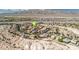 Detailed aerial perspective of a well-maintained residential area with desert landscaping at 2021 Royal Gardens Pl, North Las Vegas, NV 89084