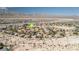 Expansive aerial view of a desert community, highlighting the neighborhood layout and mountain backdrop at 2021 Royal Gardens Pl, North Las Vegas, NV 89084