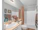 A bathroom featuring a toilet, sink, and bathtub/shower combination with white tiling at 2021 Royal Gardens Pl, North Las Vegas, NV 89084