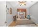 A well-lit bedroom featuring neutral tones, a bed with a decorative headboard, and two bedside tables at 2021 Royal Gardens Pl, North Las Vegas, NV 89084