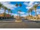 Inviting entrance to the Springdale community, framed by towering palm trees and manicured landscape at 2021 Royal Gardens Pl, North Las Vegas, NV 89084