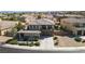 Spacious two-story home with a three-car garage, balcony, and tidy landscaping at 2021 Royal Gardens Pl, North Las Vegas, NV 89084