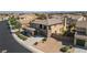 Two-story home has a three-car garage, balcony, and well-maintained landscaping at 2021 Royal Gardens Pl, North Las Vegas, NV 89084