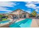 Outdoor living area featuring a pool, spa, and covered patio, ideal for entertaining at 2021 Royal Gardens Pl, North Las Vegas, NV 89084