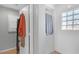 Clean and modern shower area with tiled walls, glass block window, and convenient built-in storage at 2021 Royal Gardens Pl, North Las Vegas, NV 89084