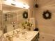 Well-lit bathroom featuring double sinks, vanity, tub, shower, and decorative accents at 2050 W Warm Springs Rd # 411, Henderson, NV 89014