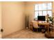 Bright bedroom featuring a desk, chair, and ample natural light from the window at 2050 W Warm Springs Rd # 411, Henderson, NV 89014