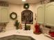 Bright kitchen with decorative touches, green cabinetry, and modern sink at 2050 W Warm Springs Rd # 411, Henderson, NV 89014