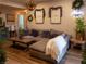 Cozy living room featuring a large sectional sofa, wood-look floors, and relaxing decor at 2050 W Warm Springs Rd # 411, Henderson, NV 89014