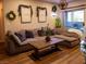 Comfortable living room features a large sectional sofa and sliding glass doors to the patio at 2050 W Warm Springs Rd # 411, Henderson, NV 89014