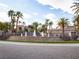 Paver street in front of tiered community water feature with palm trees and landscaping at 2050 W Warm Springs Rd # 411, Henderson, NV 89014