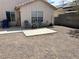 Spacious backyard with desert landscaping, and patio with chairs at 2130 Dragonslayer Ave, Las Vegas, NV 89183