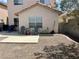 Cozy backyard featuring a patio area and chairs, ideal for outdoor relaxation and entertaining with low-maintenance gravel landscaping at 2130 Dragonslayer Ave, Las Vegas, NV 89183