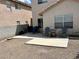 Open backyard featuring a patio area and chairs, perfect for relaxing, and minimal maintenance desert landscaping at 2130 Dragonslayer Ave, Las Vegas, NV 89183