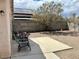 Private backyard featuring a patio area, desert landscaping, and block wall, perfect for outdoor enjoyment at 2130 Dragonslayer Ave, Las Vegas, NV 89183