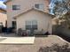 Cozy backyard featuring a patio area and chairs, ideal for outdoor relaxation and entertaining, with low-maintenance landscaping at 2130 Dragonslayer Ave, Las Vegas, NV 89183