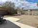 Spacious backyard with desert landscaping, providing a low-maintenance outdoor living space at 2130 Dragonslayer Ave, Las Vegas, NV 89183