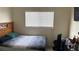 Bedroom featuring a comfortable bed, window and a TV at 2130 Dragonslayer Ave, Las Vegas, NV 89183
