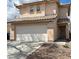 A cozy two-story house with a two-car garage and a red tile roof at 2130 Dragonslayer Ave, Las Vegas, NV 89183