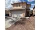A cozy two-story house with a two-car garage and a red tile roof at 2130 Dragonslayer Ave, Las Vegas, NV 89183