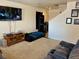 Cozy living room featuring a TV, comfortable seating, and neutral decor with carpet flooring at 2130 Dragonslayer Ave, Las Vegas, NV 89183
