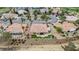 Aerial view of a single-Gathering home with patio and artificial turf backing to a golf course and desert landscaping at 2257 Lauren Dr, Las Vegas, NV 89134