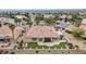 Aerial view of a single-Gathering home with patio, and desert landscaping on a golf course in a desert community at 2257 Lauren Dr, Las Vegas, NV 89134