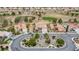 Aerial view of a cul-de-sac single Gathering home with desert landscaping backing to a golf course with mature trees at 2257 Lauren Dr, Las Vegas, NV 89134