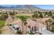 Aerial view of home with tile roof, desert landscaping, and golf course views, showcasing its prime location and curb appeal at 2257 Lauren Dr, Las Vegas, NV 89134