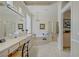 Elegant bathroom with a large vanity, step-up tub, and separate glass enclosed shower at 2257 Lauren Dr, Las Vegas, NV 89134