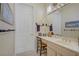 Clean bathroom featuring a single sink vanity with a chair and decorative bird accents at 2257 Lauren Dr, Las Vegas, NV 89134