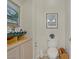 Cozy bathroom featuring a classic toilet and unique nautical decor at 2257 Lauren Dr, Las Vegas, NV 89134