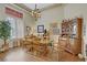 Elegant dining room featuring wood floors, a chandelier, and ample natural light with views to the outside at 2257 Lauren Dr, Las Vegas, NV 89134